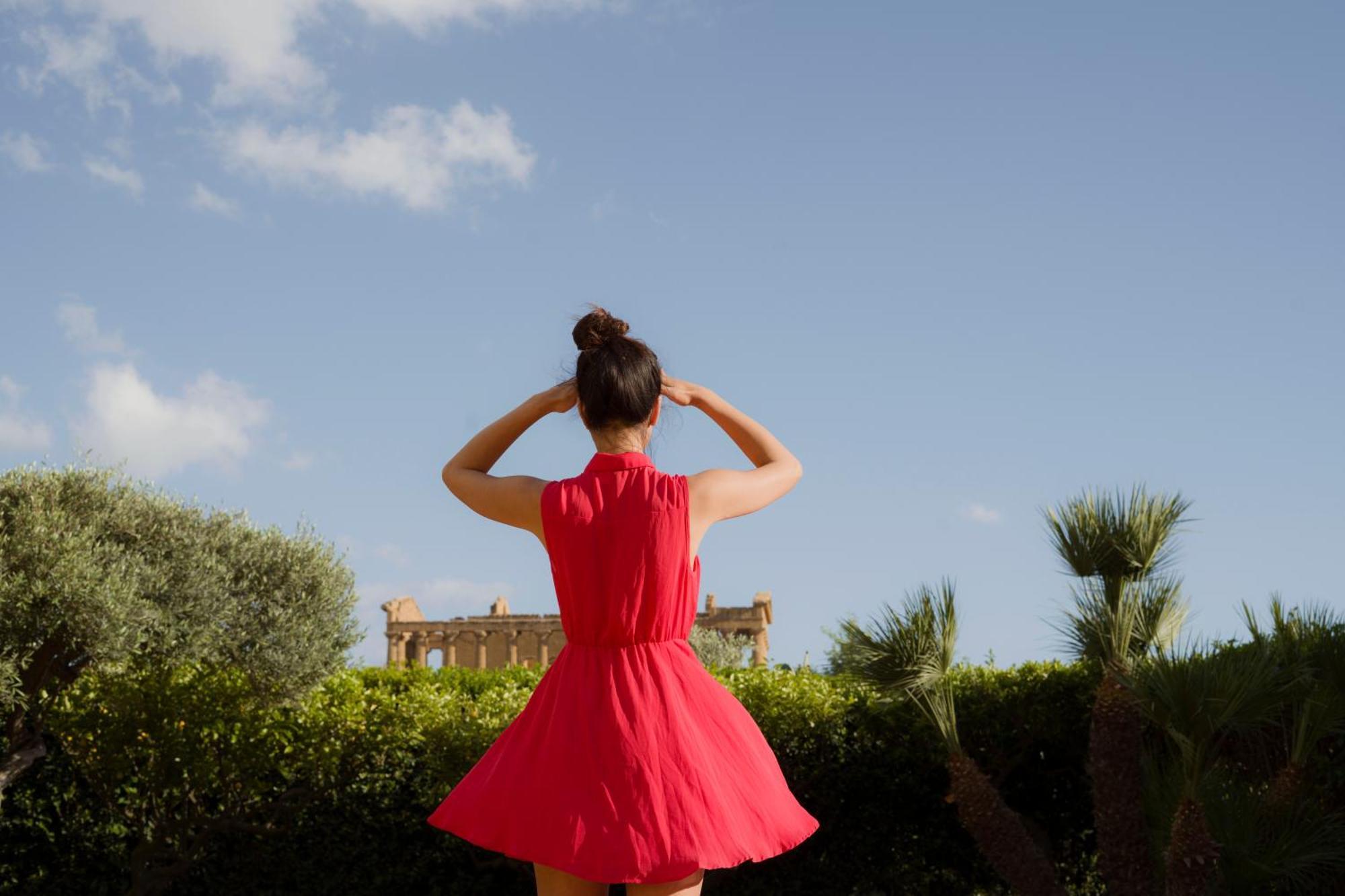 Villa Athena Resort Agrigento Ngoại thất bức ảnh A woman wearing a red dress